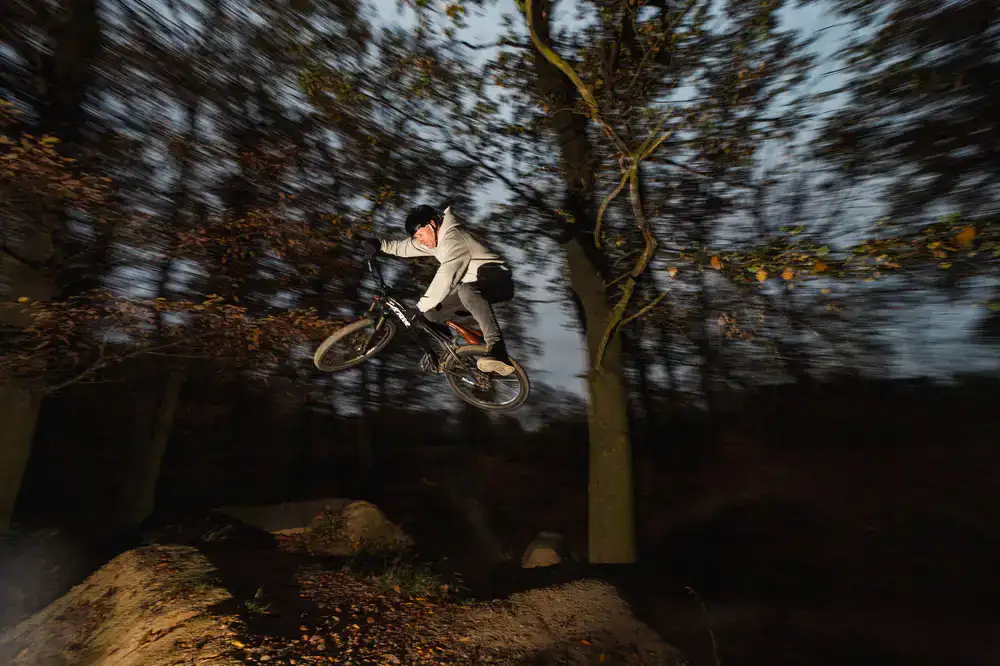A robust mountain bike being ridden on a dirt trail