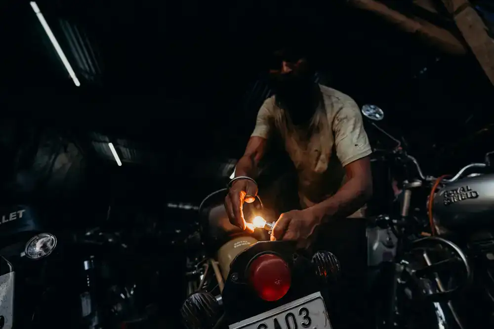 Mechanic working on a modern road bike in a clean workshop