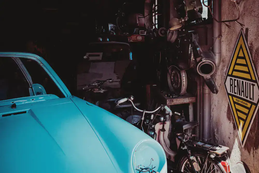 Customer unloading a bicycle from a vehicle outside the workshop